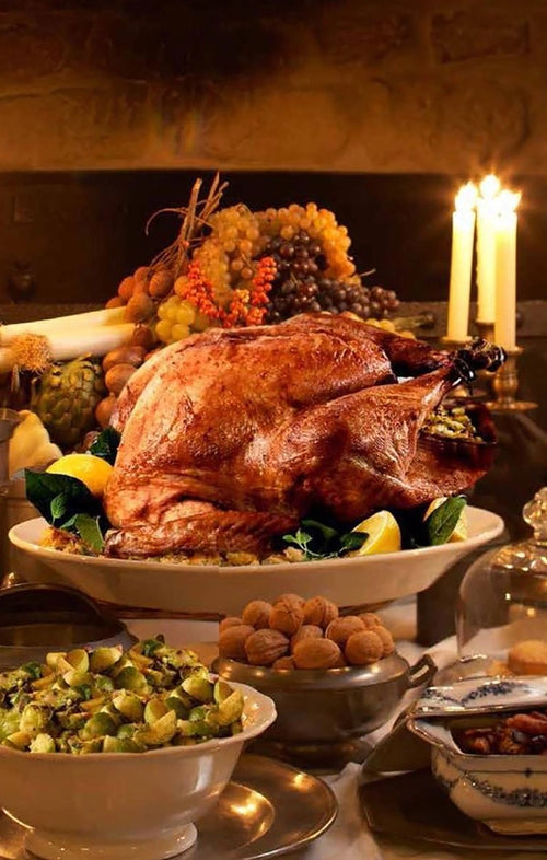 Roasted turkey with side dishes on a festive table setting.